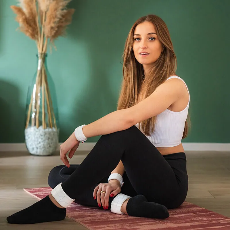 leg and wrist weights - woman doing sport at home - practical fitness accessories - gentle gym seated at the office