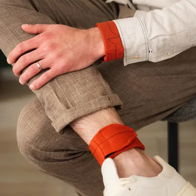 orange ankle and wrist weights - exercise discreetly in front of your desk - gentle strength training for seniors and sedentary