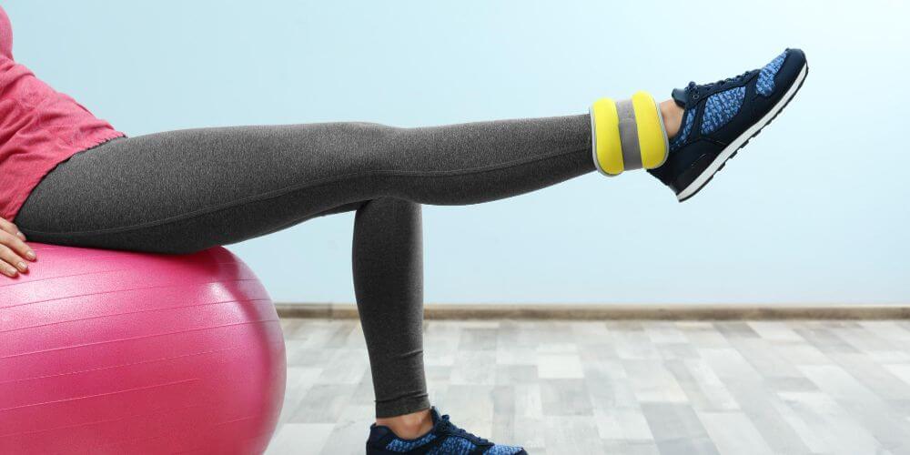 Woman doing an exercise with weighted bracelets muscle-strenghtening-with-weights